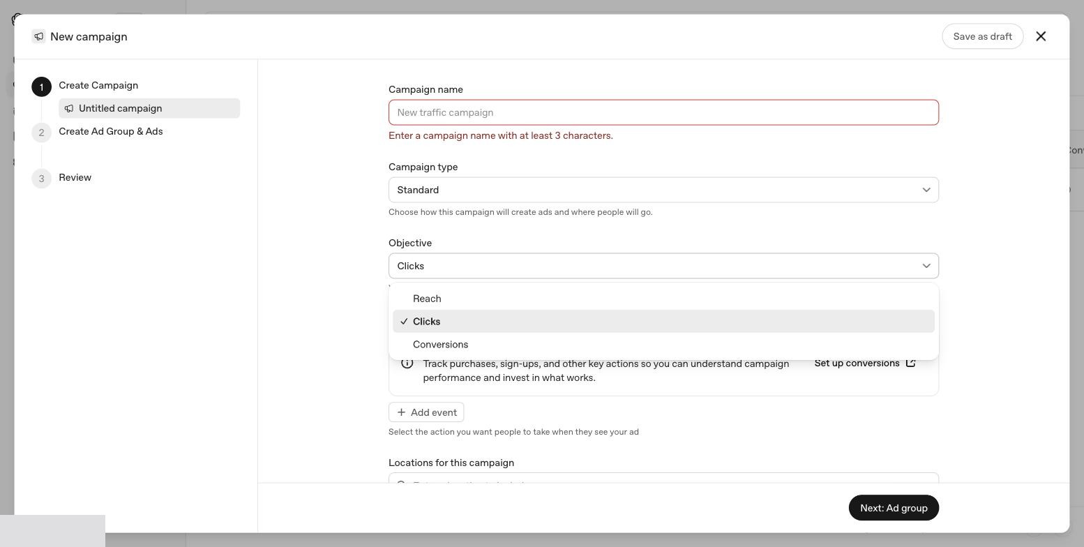 Objective-dropdown i OpenAI Ads Manager med de tre valgmuligheder: Reach, Clicks og Conversions.